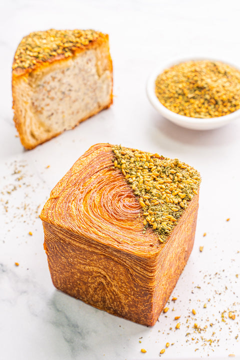 Image of Zaatar Labneh Cubes from Laura's Home Bakery, showcasing their creamy labneh cheese infused with aromatic Zaatar herbs.