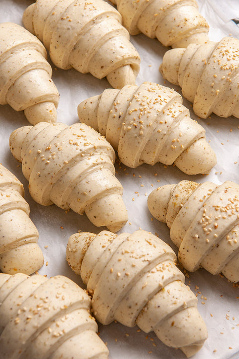 Image of Frozen Zaatar Croissants (6 pcs.) from Laura's Home Bakery, showcasing their flaky texture and generous seasoning of aromatic Zaatar herbs.