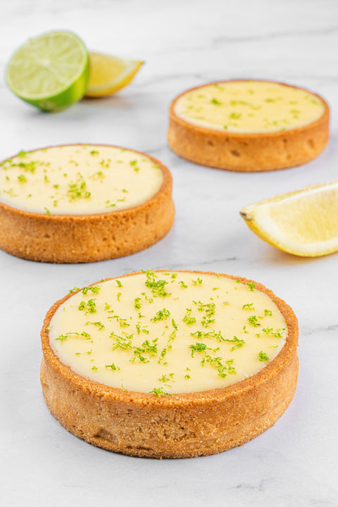 Image of a Mini Lemon Tart from Laura's Home Bakery, showcasing its buttery, flaky crust and luscious lemon curd filling