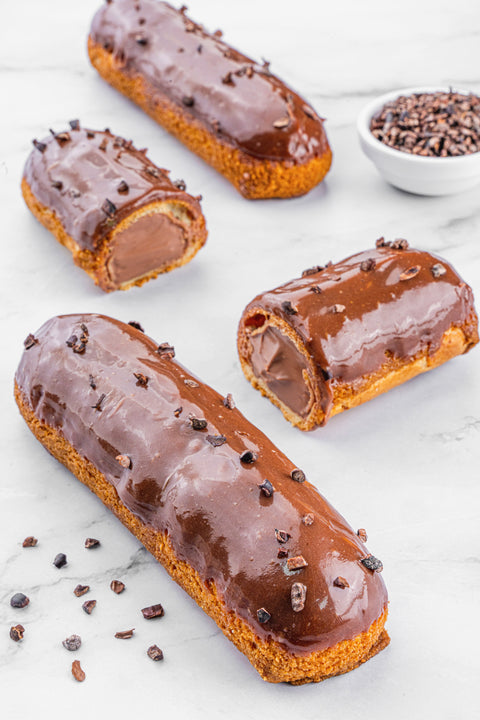 Image of Éclair Chocolate from Laura's Home Bakery, showcasing its exquisite chocolate glaze and delicate pastry layers, a sweet delight to savor