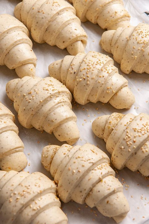 Image of Frozen Zaatar Croissants (6 pcs.) from Laura's Home Bakery, showcasing their flaky texture and generous seasoning of aromatic Zaatar herbs.